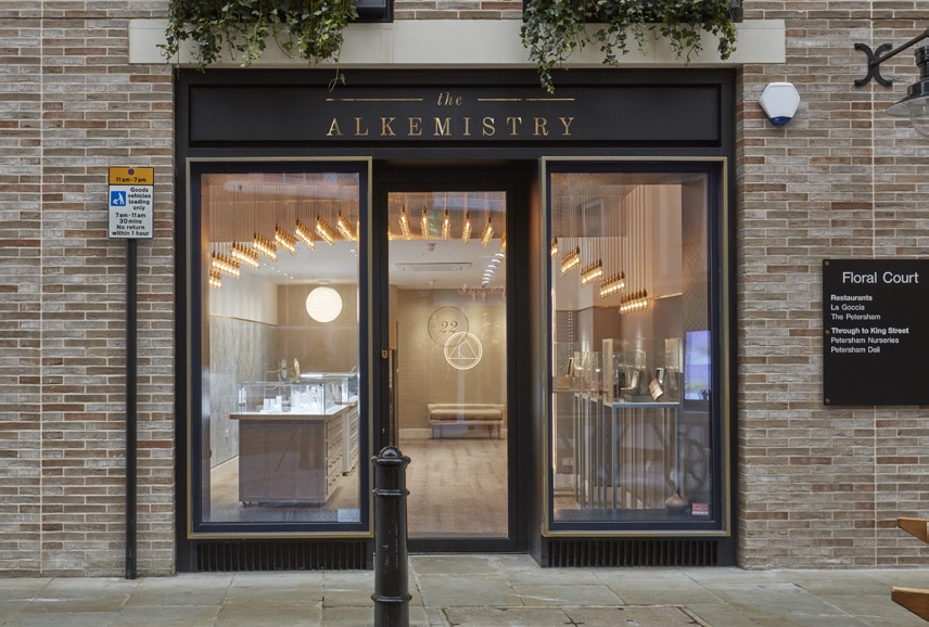 Outside view of Alkemistry store with black framed windows.