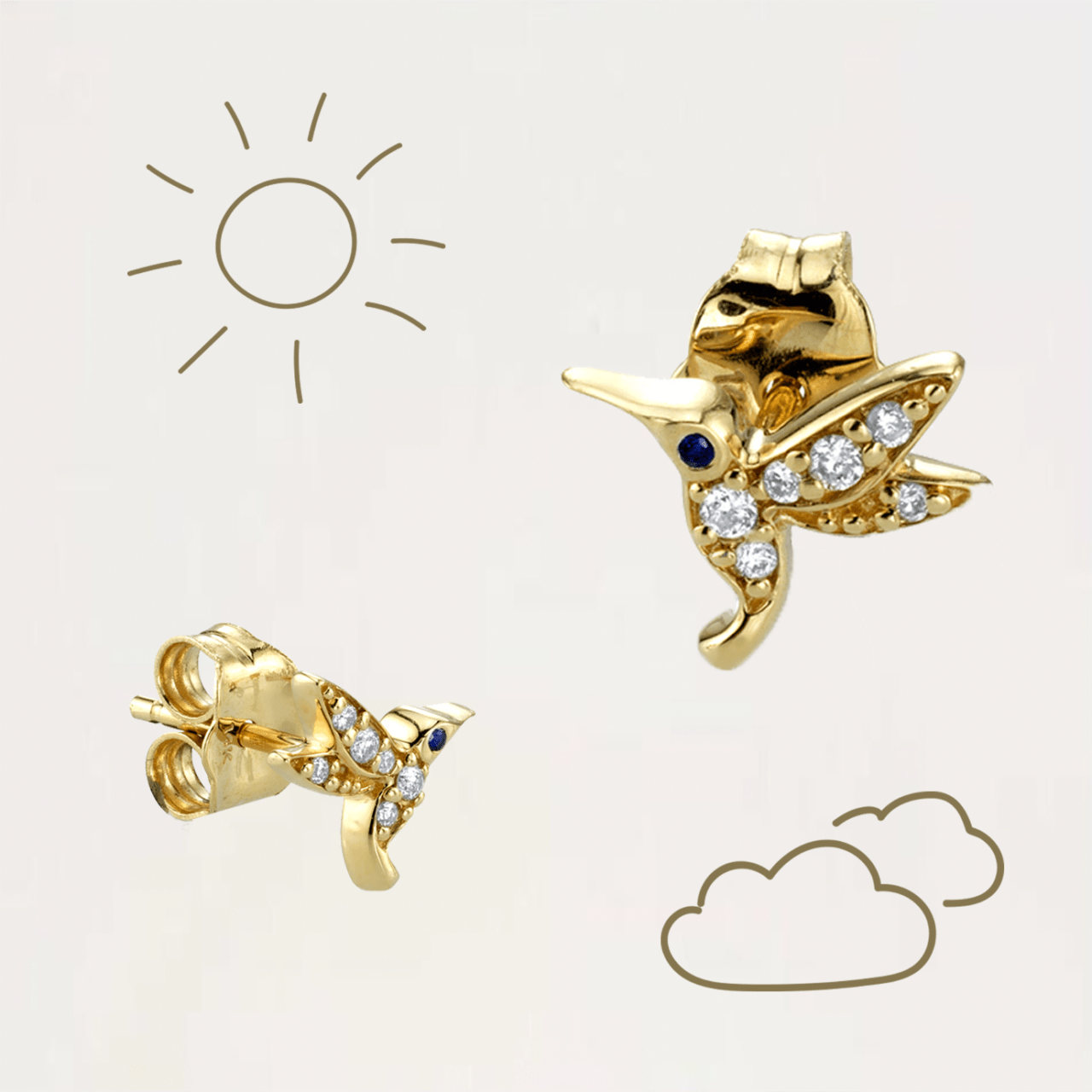 Golden hummingbird earrings with illustrations of clouds and sun.
