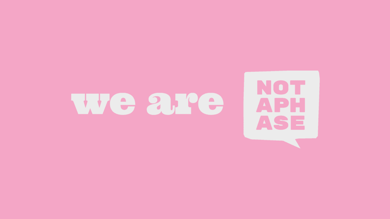 White text reading 'we are not a phase' on pink background