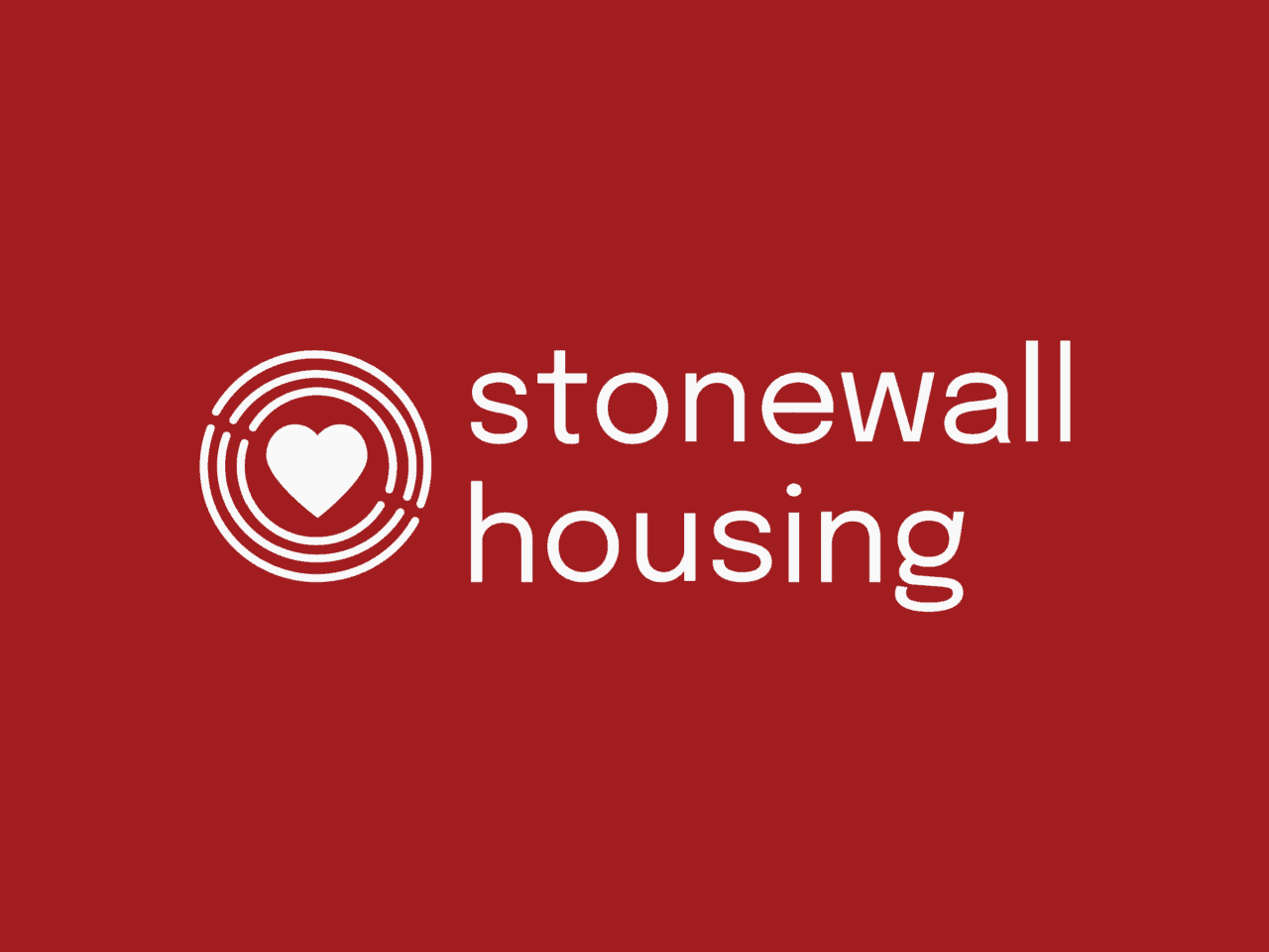 Stonewall Housing logo on a bright red background